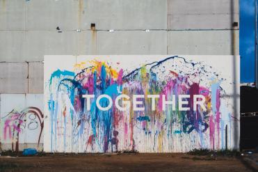 A colorful canvas and the word TOGETHER