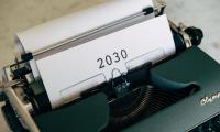 Typewriter with paper saying "2030“